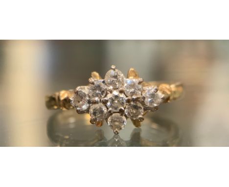 A nine stone diamond cluster ring, total estimated diamond weight approx 0.40ct,  9ct gold shank, size O, 2.6g gross 