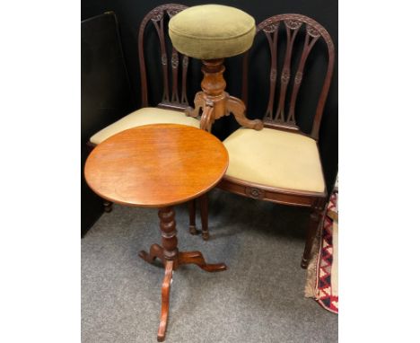 A Victorian walnut and rosewood piano stool, rotating rise-and-fall mechanism, circular seat, tripod base;  a mahogany tripod