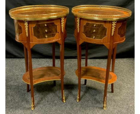 A pair of inlaid oval louis XV style side tables, gilt galleried top, three narrow drawer frieze, tapering legs, kidney shelf