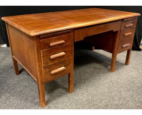 A mid century oak twin pedestal desk, by Abbess, rounded rectangular top, single long drawer to frieze over knee-hole, statio