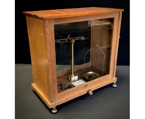 A set of Baird and Tatlock pharmaceutical weighing scales, cased. 
