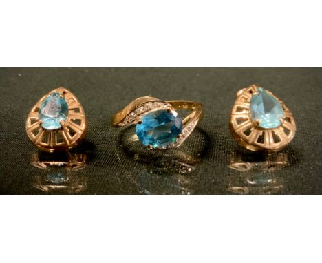 A diamond and vibrant blue stone dress ring, 9ct gold shank, size O, 2.6g gross;  pair of oval earrings, possibly topaz, stam