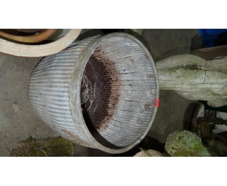 A galvanised garden planter (base rusted). 20'' high