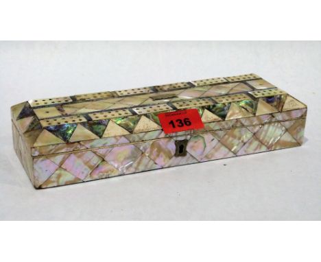 A Victorian mother-of-pearl parquetry jewel box, the lid with cribbage board. 10'' wide. Lid loose