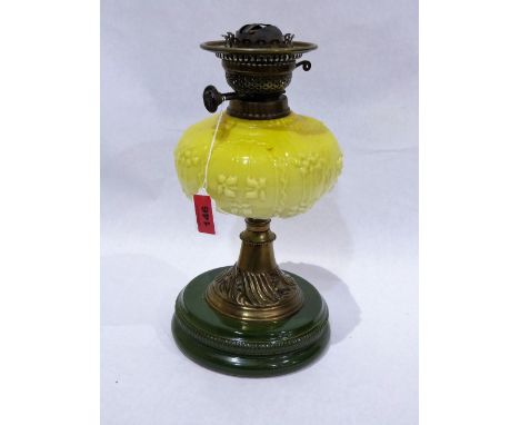 A Victorian oil lamp with yellow glass fount and duplex burner