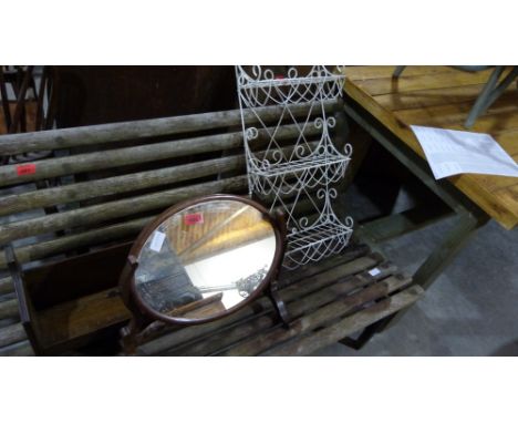A dressing mirror, book rack and a wire spice rack