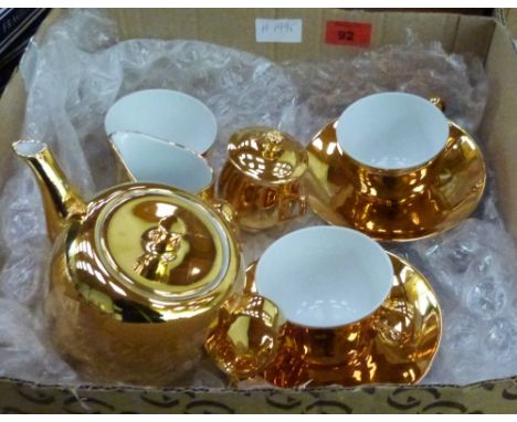 A Royal Worcester gilded tea service