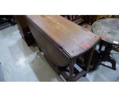 A joined oak gate leg table. 42'' wide