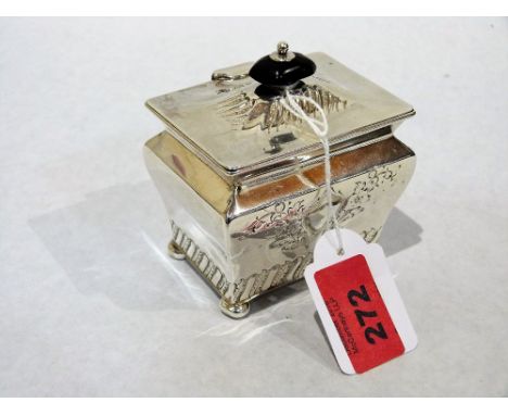 A silver tea caddy with chased decoration. 3¼'' wide. Marks rubbed. 5ozs 7dwts gross
