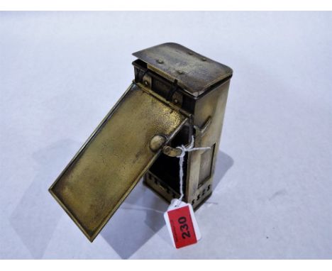 An early Victorian brass travelling coaching lamp, the hinged cover stamped Miller & Sons, 179 Piccadilly. 6'' high