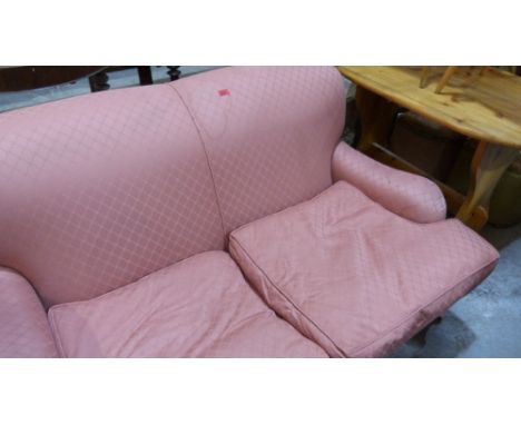 A sofa in pink brocade