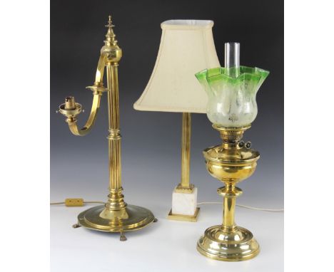 A Victorian brass oil lamp, of typical form, reservoir upon a knopped column and circular base, with green tinted and etched 