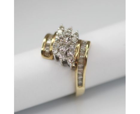 A diamond set 9ct gold cluster ring, the principle round brilliant cut diamond weighing approximately 0.08-0.10 carats, set t