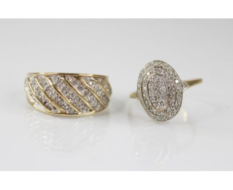 A diamond set 9ct gold cluster ring, the tiered oval shaped head set with single cut diamonds, 15.7mm x 11.5mm, pierced scrol