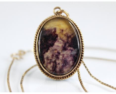 A blue john set 9ct gold pendant on chain, the oval blue john triplet set in 9ct gold to a rope twist border, marks for 'PEB'