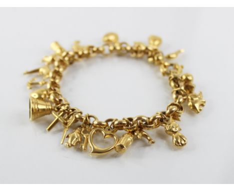 A gold coloured charm bracelet, the belcher link chain with spring ring and loop fastening, suspending an assortment of gold 
