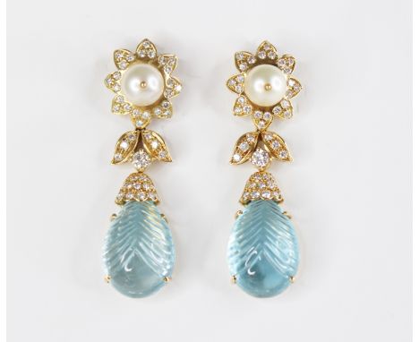 A pair of blue topaz, pearl and diamond set 18ct gold drop earrings, each designed as a round cultured pearl measuring 8mm di