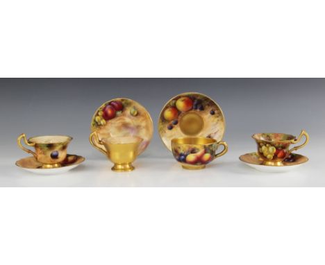 A Royal Worcester Fallen Fruits teacup and saucer, hand-painted by E.Townsend, the teacup decorated with peaches, cherries, s
