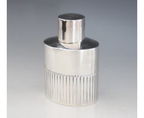 A Victorian silver tea caddy, Thomas Bradbury &amp; Sons, Sheffield 1886, of oval form with half-reeded decoration, the cover