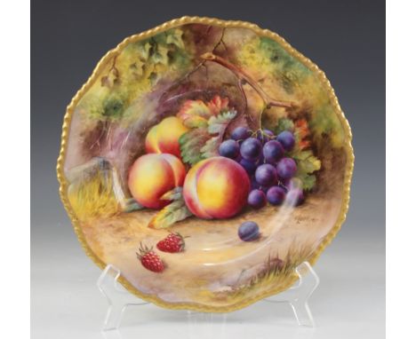 A Royal Worcester Fallen Fruits cabinet plate, hand painted by Thomas Lockyer, 1931, decorated with peaches, black grapes and