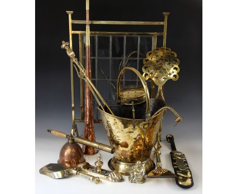 A Victorian brass and glass fire screen, with central leaded glass panel in a rectangular bass frame raised on four feet, 73c