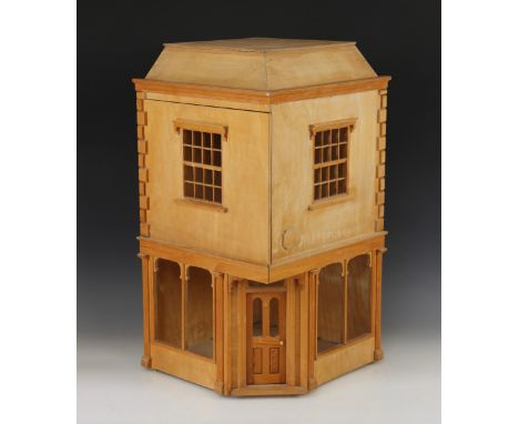 An architectural model of a corner shop, 20th century, constructed from plywood with strip wood and beading details, the hing