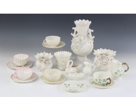 A selection of Belleek porcelain tableware, to include a florally encrusted twin handled vase, late 19th century, 25.5cm high