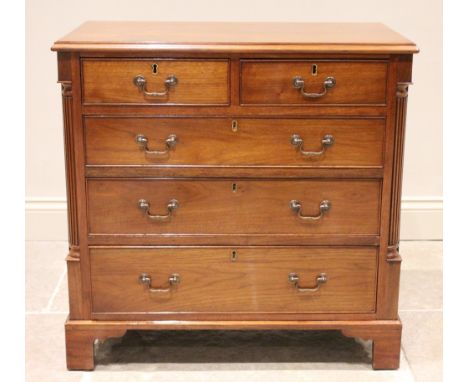 A George III style walnut chest of drawers, early 20th century, the rectangular moulded top over two short and three long gra