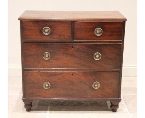 An early 19th century mahogany chest of drawers, the rectangular top with a reeded edge over two short and two long drawers, 
