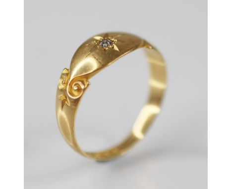 An Edwardian diamond set 18ct gold ring, the central single cut diamond gypsy star set to a navette shaped panel, continuing 