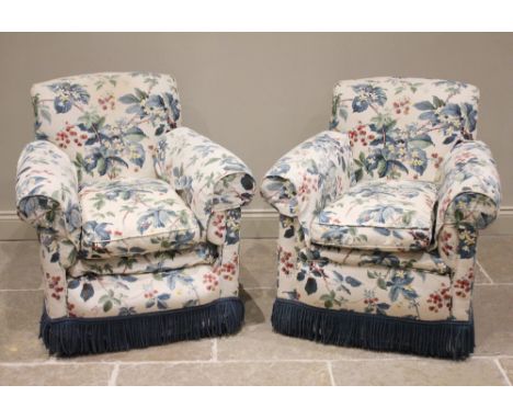 A pair of early 20th century club chairs, later re- covered in Colefax & Fowler foliate pattern fabric, each with typical dee