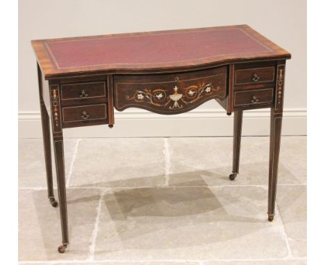 An Edwardian Sheraton Revival rosewood ladies break front writing desk, the shaped central frieze drawer inlaid with foliate 