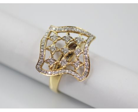 A diamond set swivel head ring, the shaped square head with pierced detail set with round mixed cut diamonds, 19mm x 19mm, se