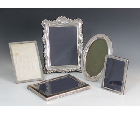 A silver mounted photograph frame, Carr's of Sheffield Ltd, Sheffield 1998, of rectangular form with scrolling floral border,