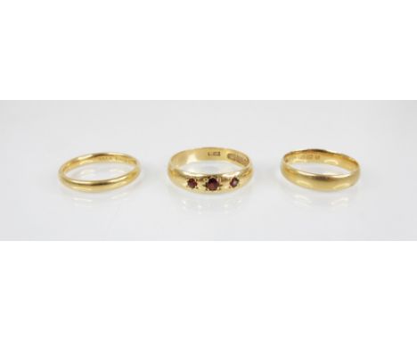 A garnet set 22ct gold ring, marks for 'H.A', Birmingham 1914, size P 1/2, together with a 22ct gold 'Fidelity' band, marks f