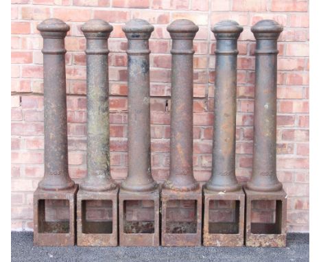 Six cast iron bollards by A.S.F (Architectural Street Furnishings), each of typical ring turned tapering form with integrated