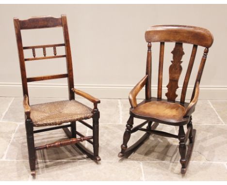 A Victorian beech rocking chair, the shaped splat back above a saddle seat enclosed by compact down swept arms, upon baluster