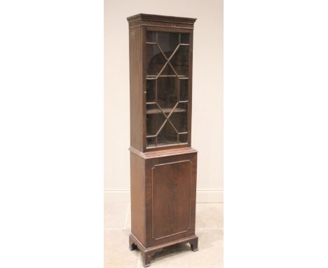 An Edwardian mahogany display cabinet, the Greek key pattern cornice and blind fretwork frieze above a single astragal glazed