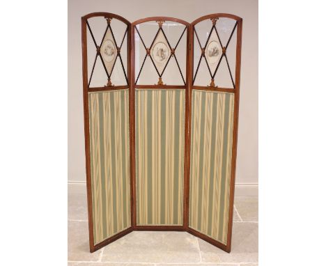 An Edwardian mahogany and satinwood cross banded three fold room screen, each arched panel with a glazed upper section centre
