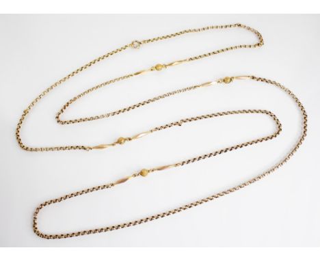 A Victorian gold coloured muff-chain, the belcher link chain interspersed by faceted torpedo and textured spherical bead spac