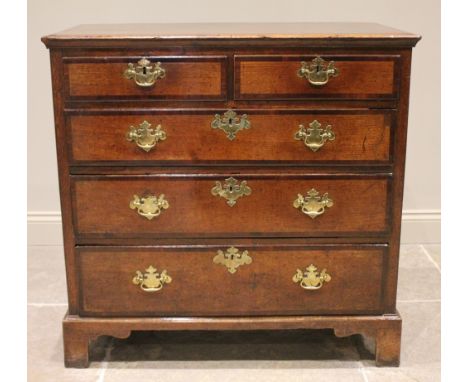 An early George III oak and mahogany cross banded chest of drawers, the rectangular moulded top over two short and three long