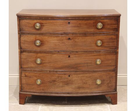 A late George III mahogany bowfront chest of drawers, formed from four graduated long drawers, applied with brass ring handle