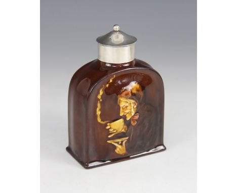 An Edwardian Royal Doulton Kingsware treacle glazed tea caddy, of shouldered form, relief moulded with an old woman drinking 