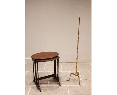 A brass standard lamp, mid 20th century, of knopped form extending to three down swept supports, 136cm high, along with a nes