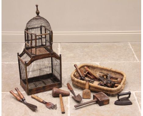 A stained wood and wirework bird cage, 20th century, of architectural form, with a domed upper section, 81cm high, along with