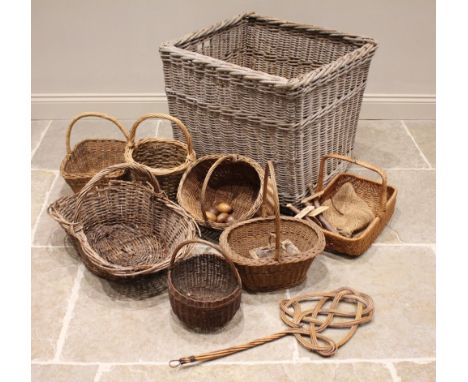 A vintage wicker laundry basket, 64cm H x 70cm Sq, along with seven assorted wicker baskets, all with overhead handles, a car