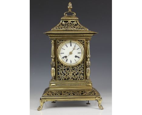 A late 19th century French gilt brass mantel clock, the foliate openwork architectural case with four baluster pilasters encl