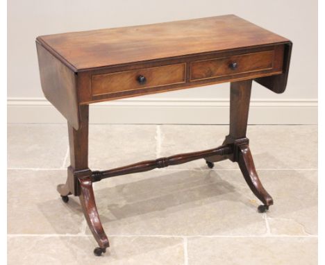 A George III mahogany sofa table, he rectangular drop leaf top above two frieze drawers, raised upon twin pedestals of taperi