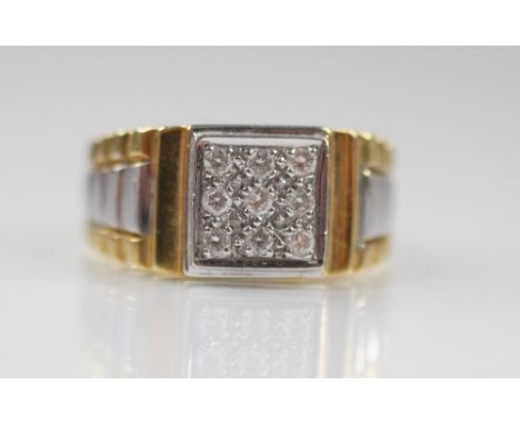 An 18ct diamond set ring, the square shaped cluster set with nine brilliant cut diamonds, 9.2mm x 9.2mm, all set in white gol