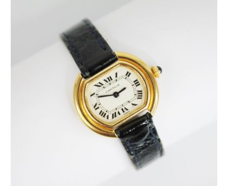 A lady's Cartier Ellipse 18ct gold wristwatch, white dial with Roman numerals and inner seconds track, set to a plain polishe